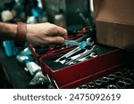 Man, hand and tool box for repair service, spanner and mechanic for maintenance in garage. Male person, equipment and wrench for fixing gear or employee at small business, labour and auto workshop