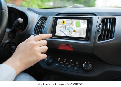 Man hand touching to screen multimedia system with  application navigation - Shutterstock ID 586938290