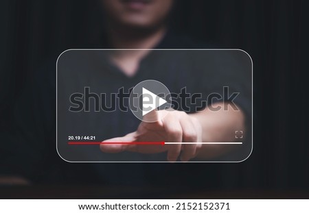Man hand touching and watching for live streaming for Video streaming on internet and multimedia technology concept.