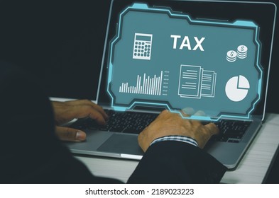 man hand typing on computer laptop icon symbol tax virtual screen Internet Business finance investment payment service digital Technology Concept. - Shutterstock ID 2189023223