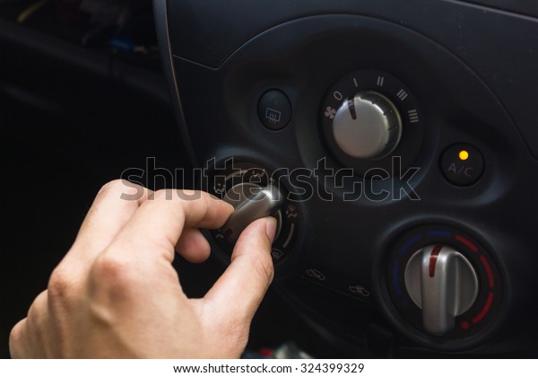 man hand\
use the signal switch. Car interior\
detail