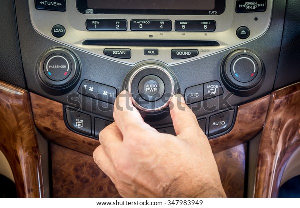 Man hand\
use the signal switch. Car interior\
detail