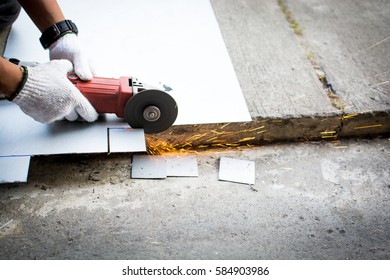 Man hand use tool cuting steel plate