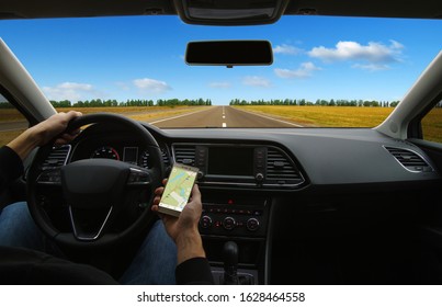 Man Hand Using GPS Navigation Inside Car