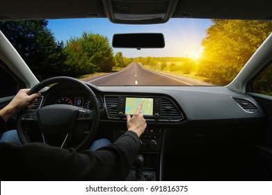 Man Hand Using GPS Navigation Inside Car