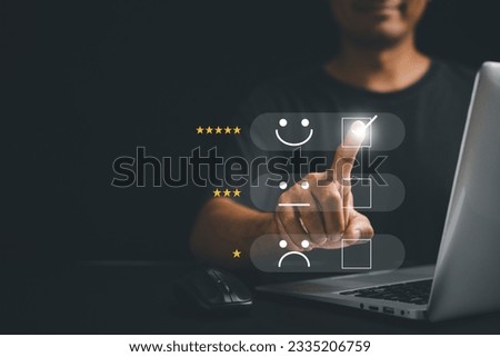 Man hand using laptop computer select 5-star popup with smile face icon for customer feedback, satisfaction survey, and service rating. Business excellence and client performance concept