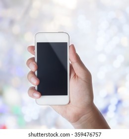 man hand using mobile smart phone with bokeh background