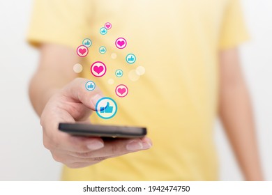 Man hand using mobile smartphone with icon social media and social network. Online marketing concept - Powered by Shutterstock - Get 15% off with code: PIKWIZARD15
