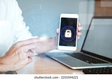 Man hand using mobile tablet protection with virtual interface of cyber security - Shutterstock ID 2255594221