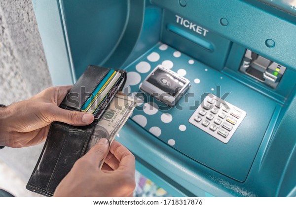 Man hand using money\
at gas pump station to pay for gasoline. Automotive industry or\
transportation and ownership concept. Delivery service concept.\
Isolated