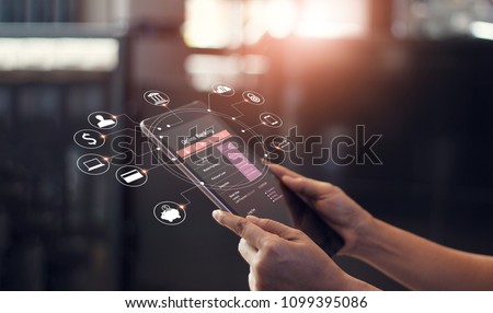Man hand using online banking and icon on tablet screen device in coffee shop. Technology E-commerce Commercial. Online payment digital and shopping on network connection. 