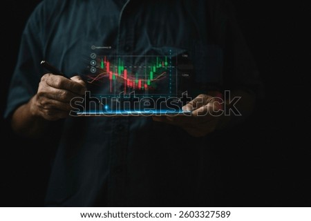 Man hand using pen to record stock trading on tablet and show virtual stock chart. Concept of stock trading investment business and stock market analysis, finance and banking.