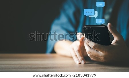 Man hand using smartphone typing live chat chatting on application communication digital web and social network concept. Social media application chat box.
