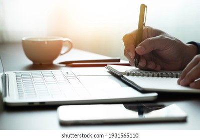 Man Hand Using Writing Pen Memo On Notebook Paper Or Letter, Diary On Table Desk Office. Workplace For Student, Writer With Copy Space. Business Working And Learning Education Concept.