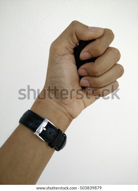 man hand wear black watches grab black key car on white\
background 