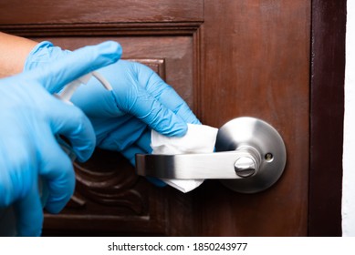 Man Hand Wear Rubber Glove Cleaning Door Knob