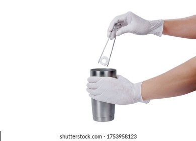 Man Hand Wearing Latex Gloves Holding Silver Thermos Mug And Tongs For Picking Ice.