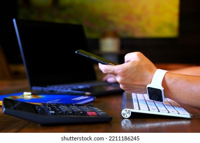 Man Hand Working On Laptop Computer On Table And Using Smartphone Home Quarantine New Normal Technology Business Concept