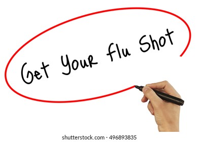 Man Hand Writing Get Your Flu Shot With Black Marker On Visual Screen. Isolated On White. Business, Technology, Internet Concept. Stock Photo