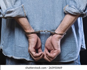 Man In Handcuffs Behind His Back