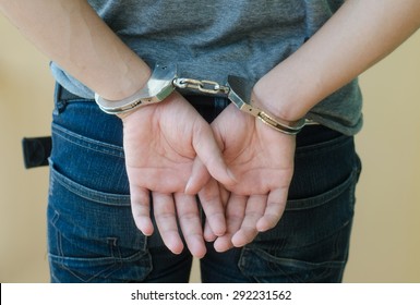 Man In Handcuffs Behind His Back