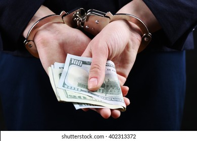 Man In Handcuffs With Money