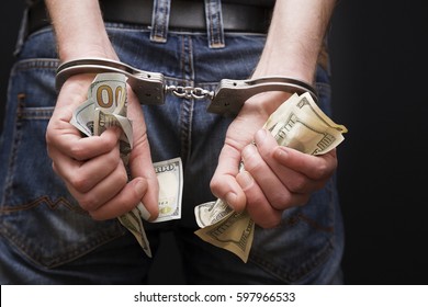 Man In Handcuffs With Money.