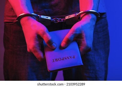 Man In Handcuffs With A Passport In His Hands, The Concept Of Arrest For Forging Documents