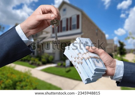 Man Handing a man Thousands of Dollars For Keys in Front of House.