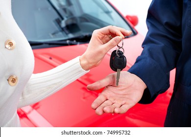 Man Handing Woman Automobile Keys. New Car