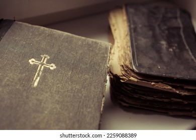 man hands and the Bible on the background - Shutterstock ID 2259088389