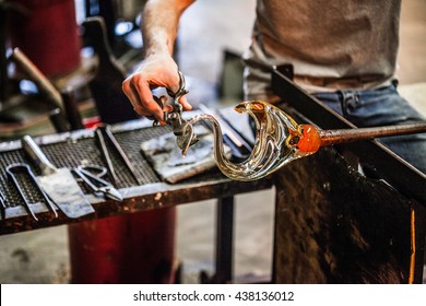Man Hands Closeup Working on a Blown Glass Piece