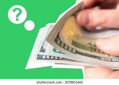 Man Hands With Dollars. He Is Counting Dollars. Question Mark As A Metaphor For Lack Of Money. Financial Uncertainty Or Problems Concept. Financial Illiteracy. Person Has Financial Problems