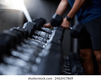 Man, hands or dumbbells in gym workout, training or exercise for strong muscle growth, healthcare wellness or bodybuilding. Zoom, texture or heavy metal weights for fitness coach or personal trainer