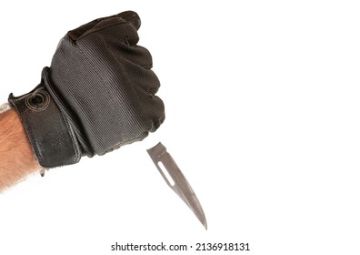 Man hands in gloves holding  the knife.