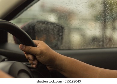 Man Hands Grip The Steering Wheel Driven Cars.