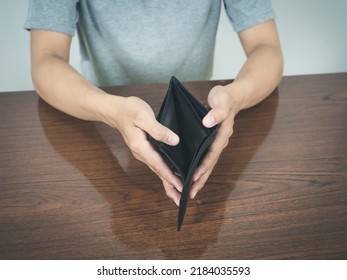 Man Hands Hold Empty Wallet No Money On The Table