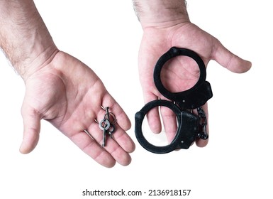 Man Hands  Holding Handcuffs And Keys.