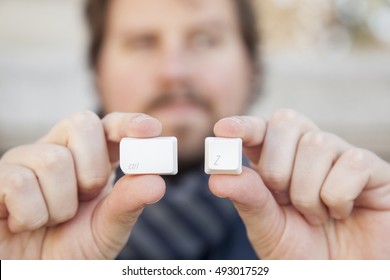 Man Hands Holding Keyboard Symbol Of  Erasing A Mistake