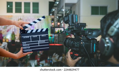 Man hands holding movie clapper.Film director concept.camera show viewfinder image catch motion in interview or broadcast wedding ceremony, catch feeling, stopped motion in best memorial day concept.