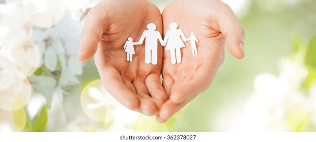 Man Hands Holding Paper Cutout Of Family