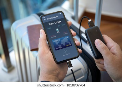 Man Hands Holding Phone With Online Payment Train Ticket App And Powerbank Suitcase Airport Lounge