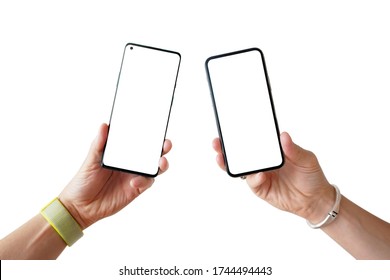 Man hands holding side by side two smartphones. Comparing, analyzing or matching two new smartphones. Blank screens on white background.