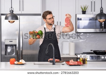 Man hands holding steak meat and big deep plate full of healthy paleo vegetarian salad made from fresh organic biological ingridients, vegetables and fruits, berries and other nutritional things