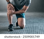 Man, hands and knee pain with injury in muscle tension, accident or fitness on floor at gym. Closeup of male person with sore leg, ache or inflammation in strain, pressure or sprain at health club