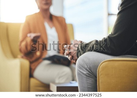 Man, hands and listening for therapy, sofa or advice from woman for mental health, psychology or care. Psychiatrist, patient and frustrated in clinic, session or couch for help, anxiety or depression