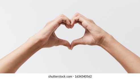 Man Hands Making A Heart Shape On A White Isolated Background