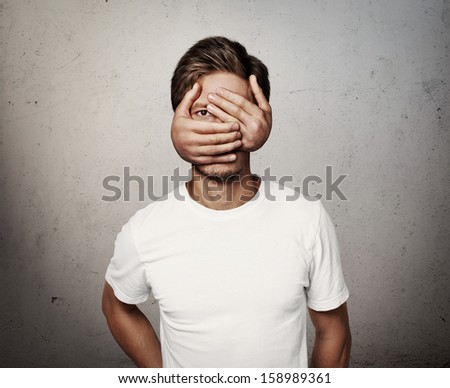 man with hands on his face