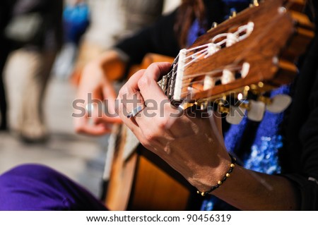 Man hands playing the Spanish guitar
