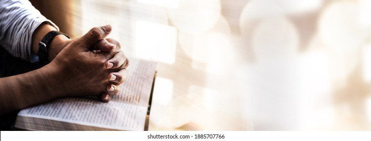 Man hands pray on bible. Concept of hope, faith, christianity, religion, church online. - Shutterstock ID 1885707766